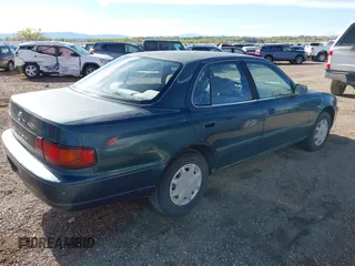 1996 Toyota Camry DX z VIN 4T1BG12K7TU661879, wystawiony jako IAAI lot #42203349 z przebiegiem 213 970 mil mil oraz . Historia ofert i sprzedaży dostępna na DreamBid. Obrazek 4.