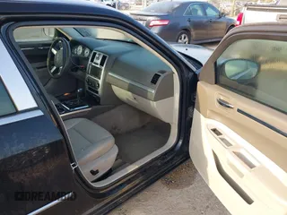 2010 Chrysler 300 Touring with VIN 2C3CA5CV0AH329717, listed as a IAAI auction lot 41785694 with 257,072 mi miles. Bid and sale history available at carsss.com. Image 5.