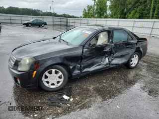 2003 Cadillac CTS with VIN 1G6DM57N830155438, listed as a Copart auction lot 59418455 with 214,660 mi miles and Salvage title. Bid and sale history available at DreamBid. Image 1.