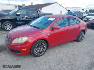 2012 Suzuki Kizashi SE with VIN JS2RE9A31C6101027, listed as a IAAI auction lot 41213426 with 174,490 mi miles. Bid and sale history available at carsss.com. Image 2.