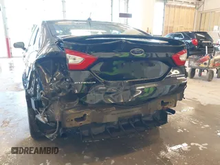 2014 Ford Fusion Titanium with VIN 3FA6P0K93ER115805, listed as a IAAI auction lot 41009602 with 136,021 mi miles. Bid and sale history available at carsss.com. Image 18.