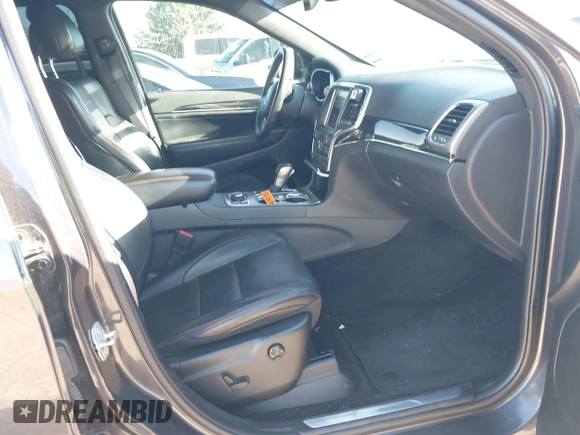 2018 Jeep Grand Cherokee Trailhawk with VIN 1C4RJFLT9JC244212, listed as a IAAI auction lot 41443469 with 77,953 mi miles and . Bid and sale history available at DreamBid. Image 5.