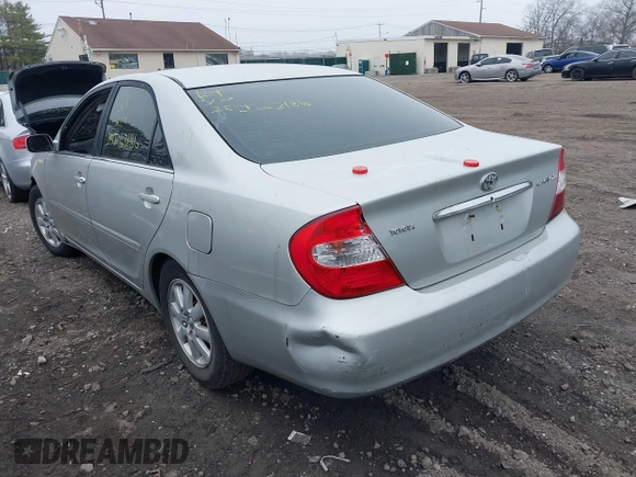 2003 Toyota Camry LE with VIN 4T1BE30K73U704489, listed as a IAAI auction lot 41905778 with Not Provided miles and . Bid and sale history available at DreamBid. Image 3.