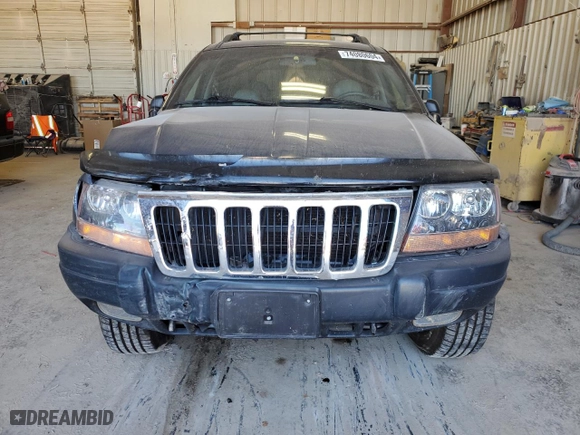 2001 Jeep Grand Cherokee Laredo with VIN 1J4GW48N41C557380, listed as a Copart auction lot 74080604 with 58,005 mi miles and Salvage Title. Bid and sale history available at carsss.com. Image 5.