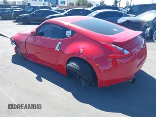 2014 Nissan 370Z Nismo with VIN JN1AZ4EH9EM636306, listed as a IAAI auction lot 41467766 with 101,021 mi miles and . Bid and sale history available at DreamBid. Image 3.
