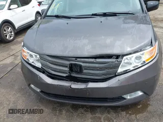 2013 Honda Odyssey Touring with VIN 5FNRL5H94DB013310, listed as a IAAI auction lot 42079565 with 128,622 mi miles and . Bid and sale history available at carsss.com. Image 6.