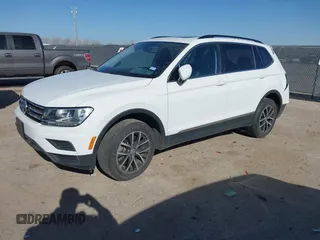 2021 Volkswagen Tiguan SE with VIN 3VV3B7AX9MM051920, listed as a IAAI auction lot 41826721 with 127,699 mi miles and . Bid and sale history available at DreamBid. Image 2.
