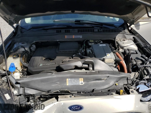 2015 Ford Fusion SE Hybrid z VIN 3FA6P0LU7FR102723, wystawiony jako Copart lot #62334345 z przebiegiem 136 341 mil mil oraz Nie do naprawy • Non repairable. Historia ofert i sprzedaży dostępna na DreamBid. Obrazek 11.