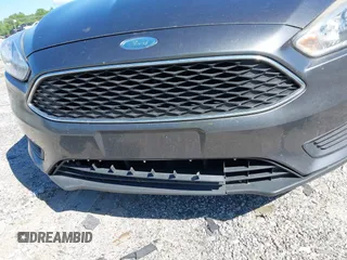2018 Ford Focus SE z VIN 1FADP3FE1JL238012, wystawiony jako IAAI lot #42185232 z przebiegiem 143 687 mil mil oraz . Historia ofert i sprzedaży dostępna na DreamBid. Obrazek 6.
