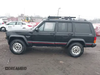 1995 Jeep Cherokee Sport with VIN 1J4FJ68S7SL572730, listed as a IAAI auction lot 41474520 with 189,907 mi miles. Bid and sale history available at carsss.com. Image 14.