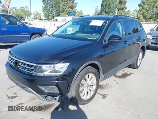 2018 Volkswagen Tiguan S with VIN 3VV1B7AX1JM091928, listed as a IAAI auction lot 42283454 with 53,650 mi miles and . Bid and sale history available at DreamBid. Image 6.