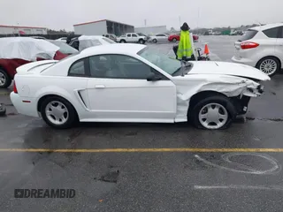 1999 Ford Mustang z VIN 1FAFP4049XF152937, wystawiony jako IAAI lot #41570514 z przebiegiem 185 382 mil mil oraz . Historia ofert i sprzedaży dostępna na DreamBid. Obrazek 14.