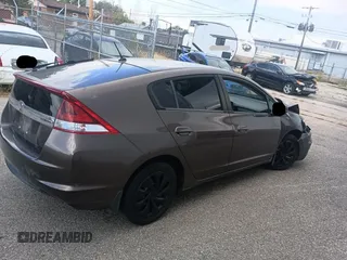 2012 Honda Insight LX with VIN JHMZE2H50CS004626, listed as a Copart auction lot 65198795 with 153,085 mi miles and Clean title. Bid and sale history available at DreamBid. Image 4.