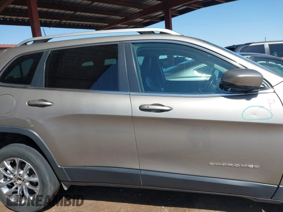 2021 Jeep Cherokee Altitude with VIN 1C4PJLLBXMD155096, listed as a IAAI auction lot 41746319 with 99,423 mi miles and . Bid and sale history available at DreamBid. Image 14.