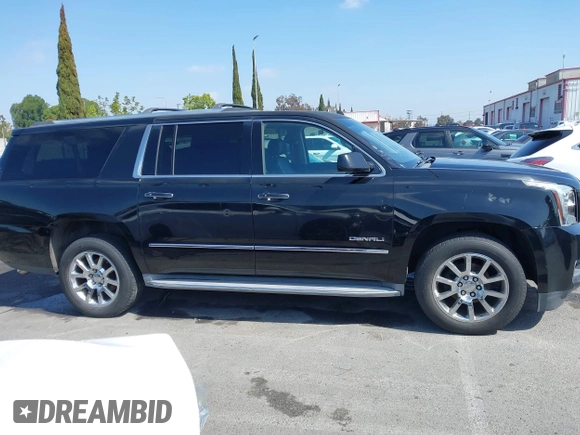 2015 GMC Yukon XL Denali with VIN 1GKS1JKJ1FR134428, listed as a IAAI auction lot 42149588 with 116,207 mi miles. Bid and sale history available at carsss.com. Image 13.