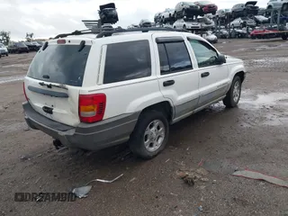 2000 Jeep Grand Cherokee Laredo z VIN 1J4G248S2YC339997, wystawiony jako IAAI lot #42395079 z przebiegiem 261 704 mil mil oraz . Historia ofert i sprzedaży dostępna na DreamBid. Obrazek 4.