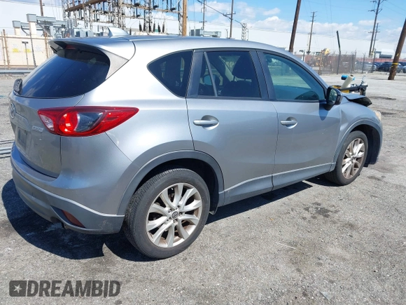 2014 Mazda CX-5 Grand Touring with VIN JM3KE2DY0E0331942, listed as a IAAI auction lot 41750533 with 163,387 mi miles. Bid and sale history available at carsss.com. Image 4.