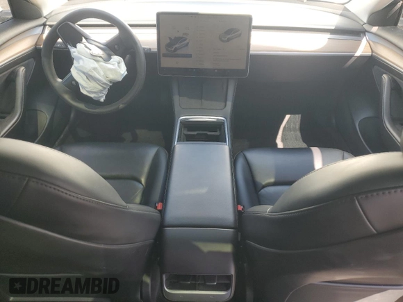 2023 Tesla Model 3 with VIN 5YJ3E1EA8PF394705, listed as a Copart auction lot 52319945 with 58,193 mi miles and Salvage title. Bid and sale history available at DreamBid. Image 8.