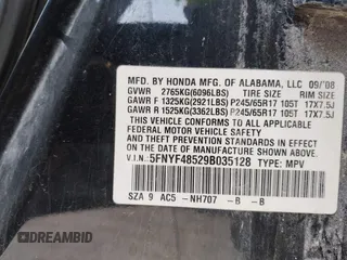 2009 Honda Pilot EX-L with VIN 5FNYF48529B035128, listed as a IAAI auction lot 42006450 with 214,069 mi miles. Bid and sale history available at carsss.com. Image 9.
