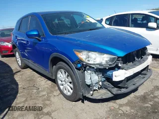 2014 Mazda CX-5 Touring with VIN JM3KE2CYXE0316933, listed as a IAAI auction lot 41853493 with 128,731 mi miles. Bid and sale history available at carsss.com. Image 1.