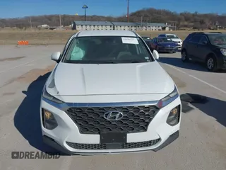 2019 Hyundai Santa Fe SE with VIN 5NMS2CAD4KH118545, listed as a IAAI auction lot 41686797 with 54,108 mi miles and . Bid and sale history available at DreamBid. Image 12.