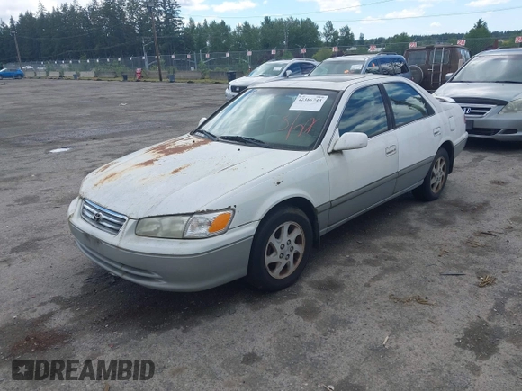 2001 Toyota Camry LE z VIN JT2BF22K310304712, wystawiony jako IAAI lot #42386743 z przebiegiem 103 552 mil mil oraz . Historia ofert i sprzedaży dostępna na DreamBid. Obrazek 2.