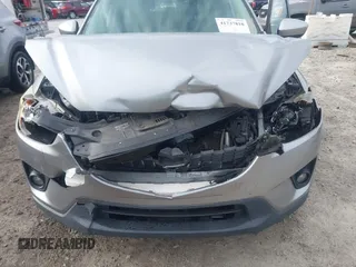 2015 Mazda CX-5 Touring with VIN JM3KE2CYXF0435583, listed as a IAAI auction lot 41737810 with 107,270 mi miles and . Bid and sale history available at DreamBid. Image 6.