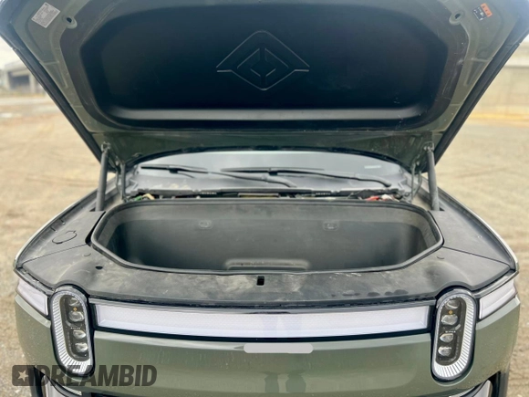 2023 Rivian R1S Launch Edition with VIN 7PDSGABL2PN003733, listed as a Copart auction lot 56033315 with 9,996 mi miles and Salvage Title. Bid and sale history available at carsss.com. Image 7.
