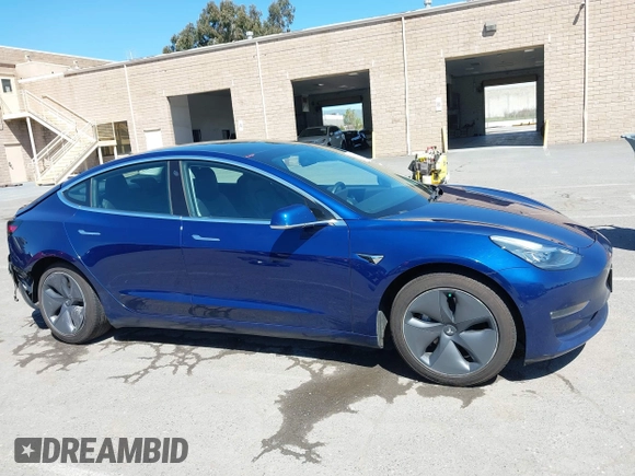 2019 Tesla Model 3 Mid Range with VIN 5YJ3E1EA0KF425079, listed as a IAAI auction lot 41871022 with 61,684 mi miles and . Bid and sale history available at DreamBid. Image 13.