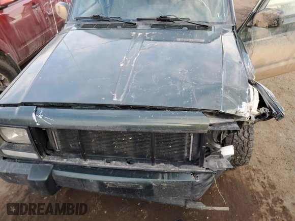 1997 Jeep Cherokee Country with VIN 1J4FJ78SXVL566804, listed as a Copart auction lot 88557395 with 216,230 mi miles and Salvage title. Bid and sale history available at DreamBid. Image 13.