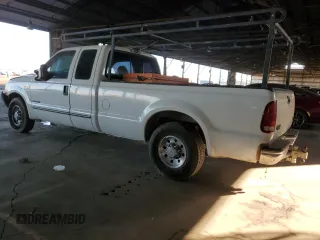 1999 Ford F-250 XL with VIN 1FTNX20FXXEE59499, listed as a Copart auction lot 87511735 with 215,520 mi miles and Salvage title. Bid and sale history available at DreamBid. Image 2.