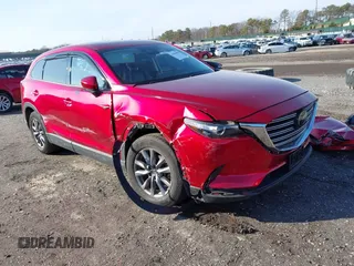 2021 Mazda CX-9 Touring z VIN JM3TCBCYXM0506837, wystawiony jako IAAI lot #41494903 z przebiegiem 23 765 mil mil oraz . Historia ofert i sprzedaży dostępna na DreamBid. Obrazek 1.
