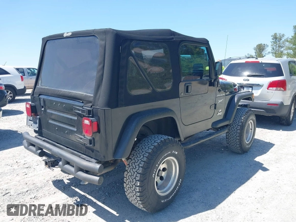 2002 Jeep Wrangler Sport with VIN 1J4FA49S52P700846, listed as a IAAI auction lot 42052276 with 231,851 mi miles. Bid and sale history available at carsss.com. Image 4.