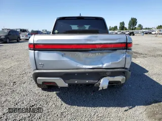 2023 Rivian R1T Adventure z VIN 7FCTGBAA0PN025046, wystawiony jako Copart lot #62502274 z przebiegiem 1385 mil mil oraz Szkody całkowita. Historia ofert i sprzedaży dostępna na DreamBid. Obrazek 6.