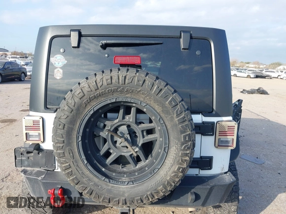 2017 Jeep Wrangler Unlimited Sport with VIN 1C4HJWDG1HL580136, listed as a IAAI auction lot 41193905 with 63,875 mi miles. Bid and sale history available at carsss.com. Image 16.