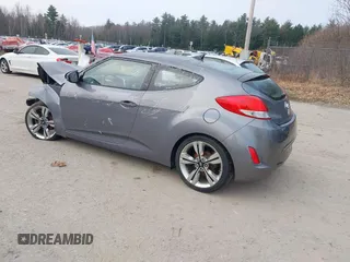 2014 Hyundai Veloster with VIN KMHTC6AD5EU183478, listed as a IAAI auction lot 42107170 with 64,905 mi miles. Bid and sale history available at carsss.com. Image 3.