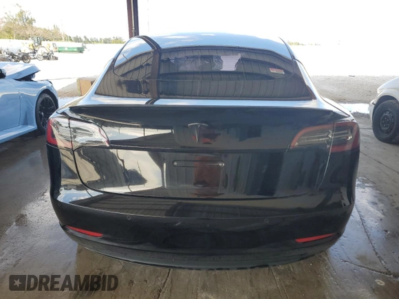 2021 Tesla Model 3 Standard Range Plus with VIN 5YJ3E1EA2MF048564, listed as a Copart auction lot 88754285 with 57,894 mi miles and Non Repairable. Bid and sale history available at DreamBid. Image 6.
