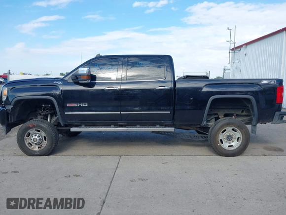2015 GMC Sierra 2500HD SLT with VIN 1GT12ZE87FF552599, listed as a IAAI auction lot 40054977 with 146,190 mi miles and . Bid and sale history available at DreamBid. Image 13.