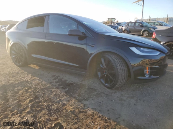 2021 Tesla Model X P100D with VIN 5YJXCDE42MF319772, listed as a Copart auction lot 87680155 with NaN miles and Salvage Title. Bid and sale history available at carsss.com. Image 4.
