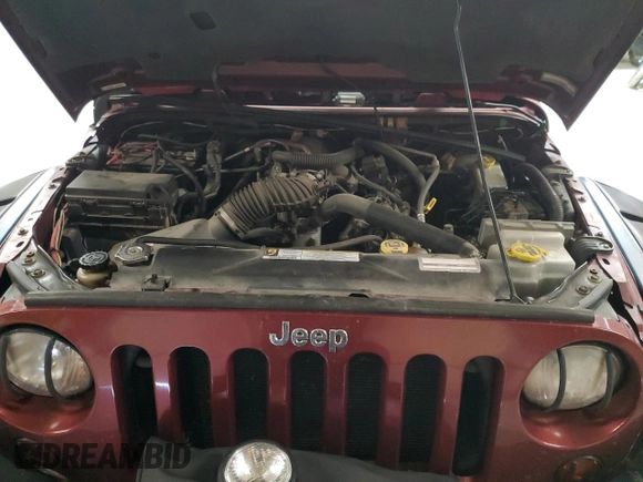 2007 Jeep Wrangler Sahara z VIN 1J4FA54127L132543, wystawiony jako Copart lot #55891995 z przebiegiem 74 616 mil mil oraz Szkoda całkowita • Salvage title. Historia ofert i sprzedaży dostępna na DreamBid. Obrazek 11.