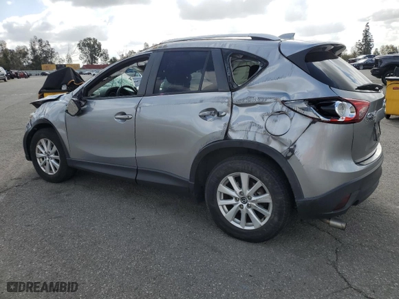 2014 Mazda CX-5 Touring with VIN JM3KE2CYXE0320996, listed as a Copart auction lot 51366485 with 102,472 mi miles and Salvage Title. Bid and sale history available at carsss.com. Image 2.