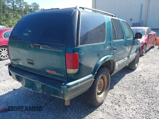 1997 GMC Jimmy SLE z VIN 1GKCS13W0V2524634, wystawiony jako IAAI lot #42196586 z przebiegiem 371 254 mil mil oraz . Historia ofert i sprzedaży dostępna na DreamBid. Obrazek 4.
