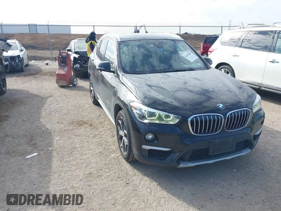 2016 BMW X1 xDrive28i with VIN WBXHT3Z3XG4A48557, listed as a IAAI auction lot 41387960 with 84,821 mi miles. Bid and sale history available at carsss.com. Image 1.