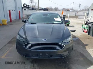 2019 Ford Fusion Hybrid SE with VIN 3FA6P0LU6KR163927, listed as a IAAI auction lot 41834612 with 104,342 mi miles. Bid and sale history available at carsss.com. Image 13.