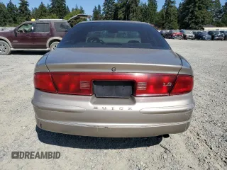 1999 Buick Regal LS with VIN 2G4WB52K8X1624610, listed as a Copart auction lot 64716284 with 106,902 mi miles and Salvage Title. Bid and sale history available at carsss.com. Image 6.