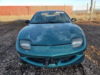 1997 Pontiac Sunfire SE z VIN 1G2JB12T9V7579374, wystawiony jako Copart lot #41468144 z przebiegiem 153 533 mil mil oraz Tytuł czysty. Historia ofert i sprzedaży dostępna na DreamBid. Obrazek 5.