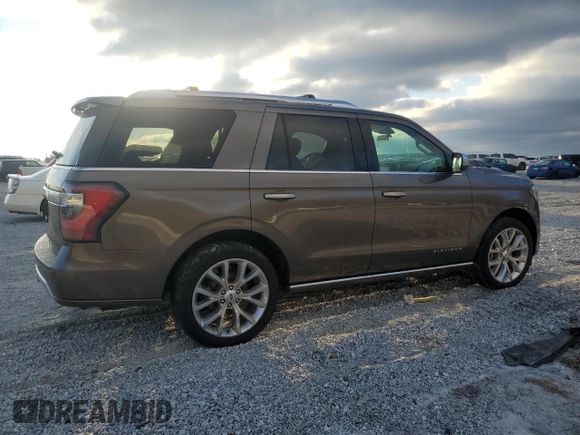 2019 Ford Expedition Platinum with VIN 1FMJU1LTXKEA56503, listed as a Copart auction lot 45657785 with 104,839 mi miles and Salvage Title. Bid and sale history available at carsss.com. Image 3.