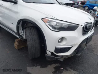 2018 BMW X1 sDrive28i with VIN WBXHU7C32J5H44246, listed as a IAAI auction lot 41477050 with 69,858 mi miles. Bid and sale history available at carsss.com. Image 6.