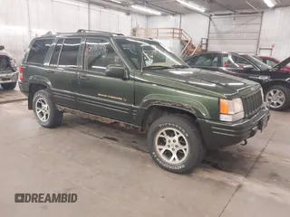 1997 Jeep Grand Cherokee Limited with VIN 1J4GZ78Y0VC684023, listed as a IAAI auction lot 42090436 with 310,831 mi miles. Bid and sale history available at carsss.com. Image 1.