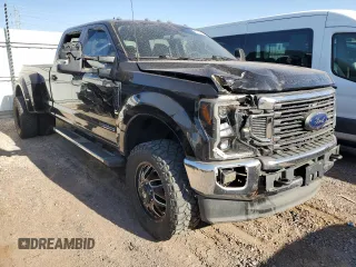 2022 Ford F-350 XL with VIN 1FT8W3DT9NEC09111, listed as a Copart auction lot 52178455 with 128,690 mi miles and Salvage title. Bid and sale history available at DreamBid. Image 4.